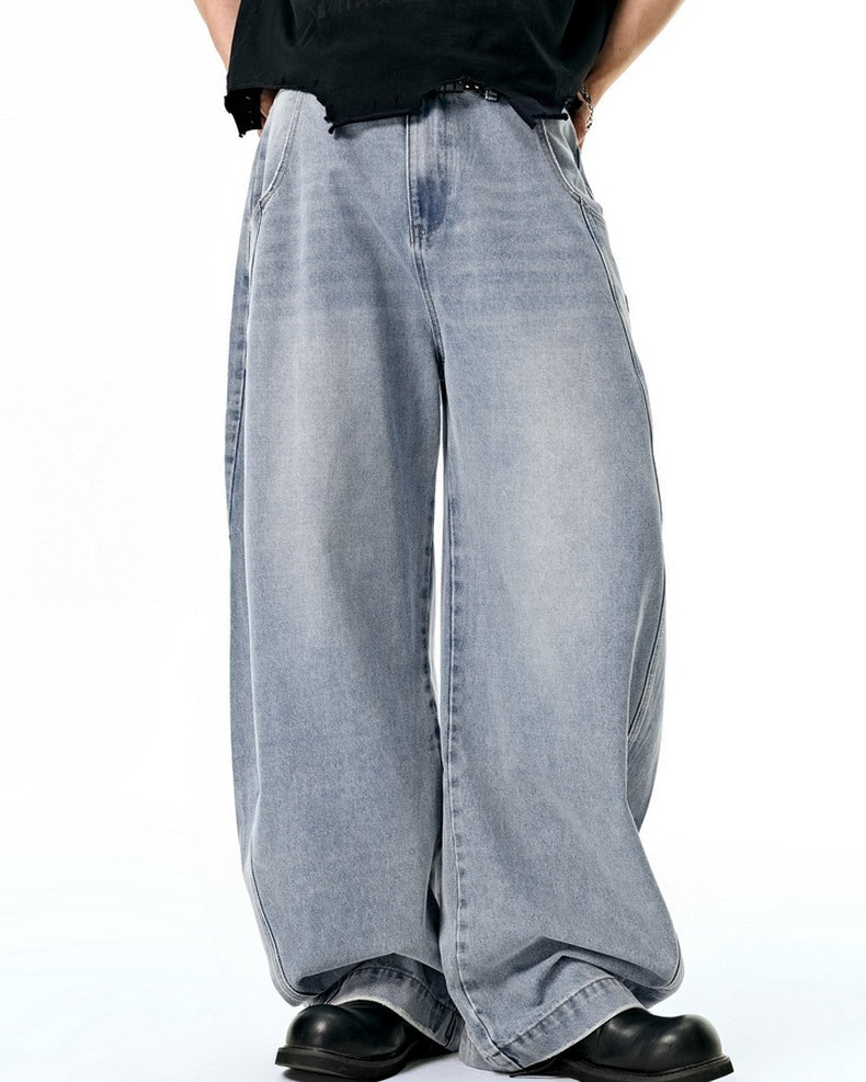 Light blue wide leg jeans detail, soft washed denim texture