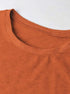 Close-up of mock neck ribbed collar and soft knit, terracotta sweatshirt