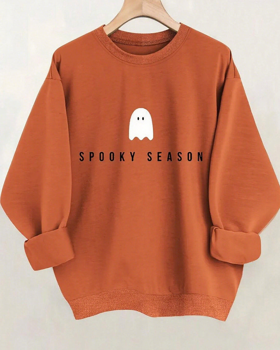 Mock neck oversized sweatshirt terracotta, back view with small ghost print on hanger