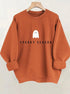 Mock neck oversized sweatshirt terracotta, back view with small ghost print on hanger
