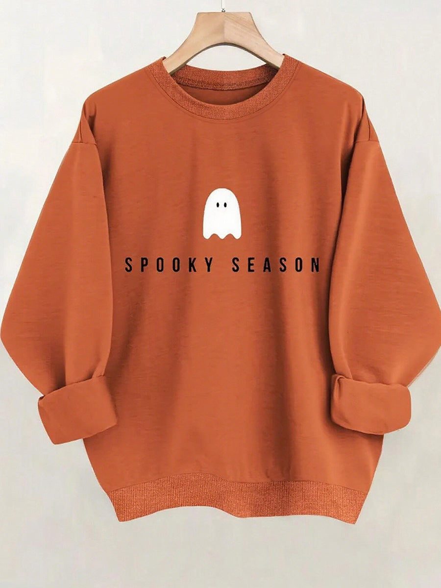 Mock neck oversized sweatshirt terracotta, back view with small ghost print on hanger