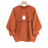 Terracotta mock neck oversized sweatshirt front on hanger, rolled cuffs