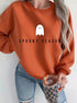 Mock neck oversized sweatshirt in terracotta with ghost “Spooky Season” print, front on model