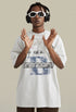 Model in white tee raises hands while wearing bold street accessories.