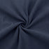 Close-up of navy blue ribbed fabric with a swirl pattern