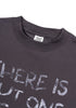 Close-up neckline view of dark purple 'Never Give Up' tee