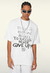 Close-up of model in white tee with statement text, wearing sunglasses.