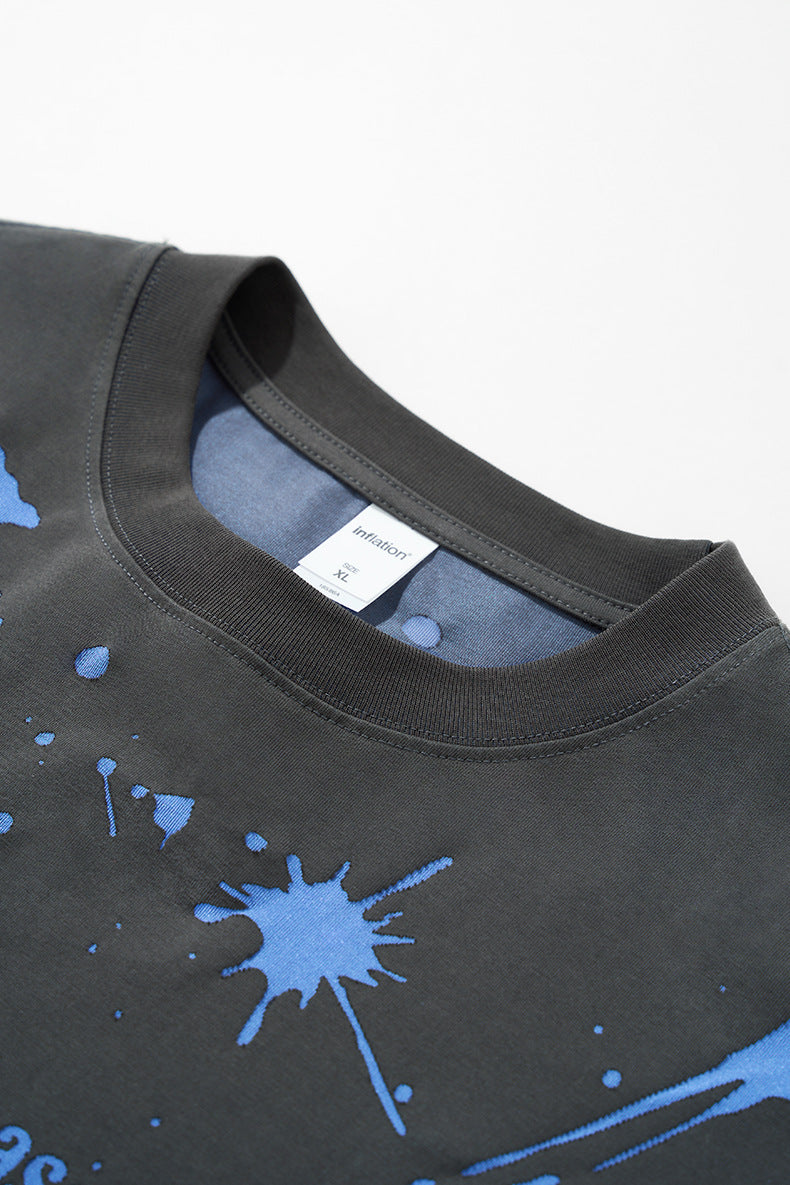Close-up neckline of black "NO More Ideas" long sleeve graphic tee