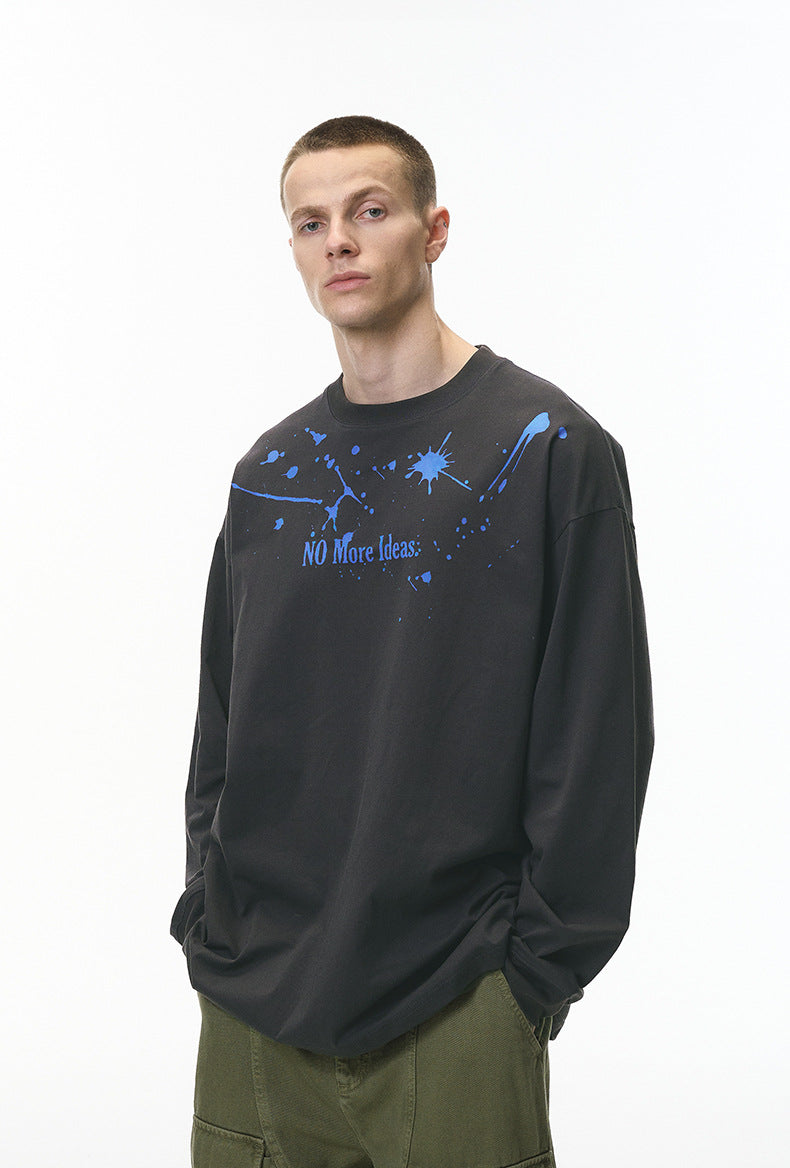 Male model wearing gray "NO More Ideas" streetwear long sleeve tee