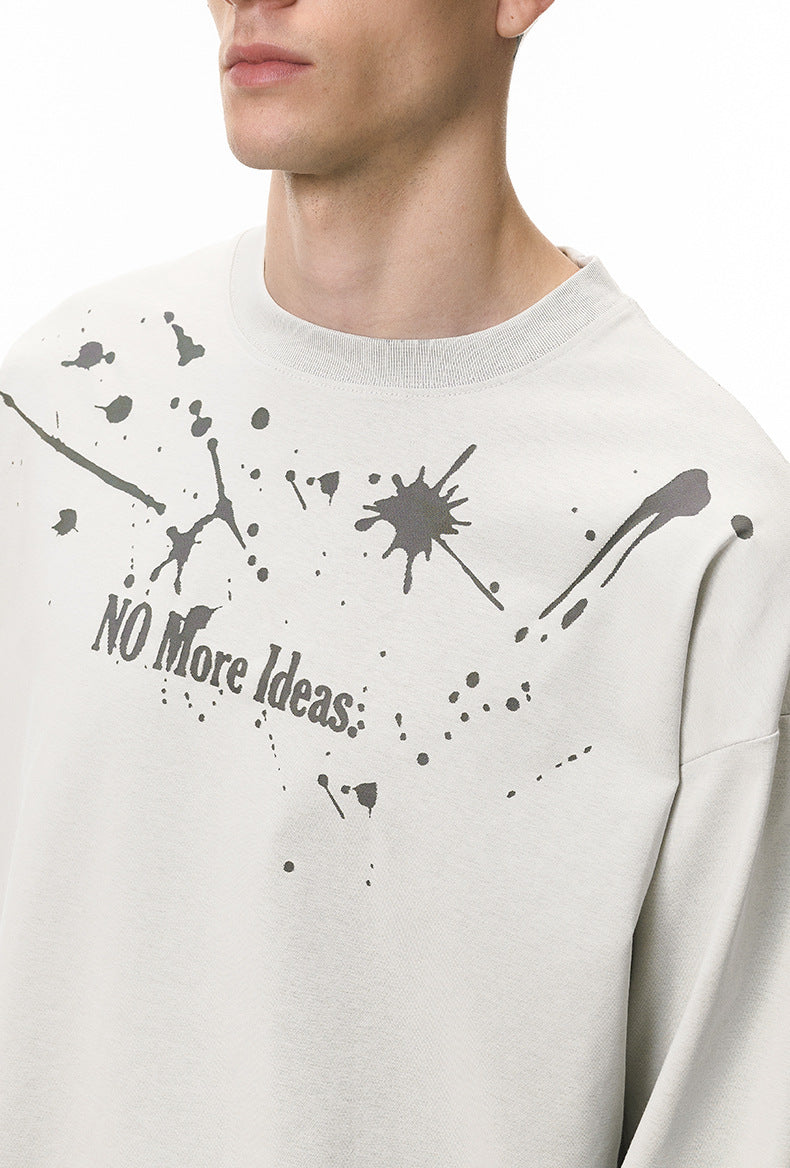 Close-up of off-white "NO More Ideas" graphic print on long sleeve t-shirt