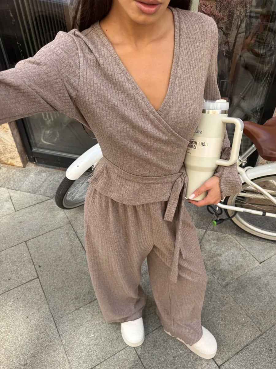 close-up of oatmeal ribbed wrap top sleeve and waist tie