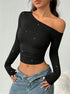 off shoulder top black ribbed, long sleeves, cropped slim fit, front view on model with jeans