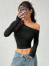 mirror selfie, black off shoulder top with long sleeves, cropped slim fit styled with denim