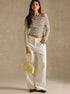 off shoulder striped top full outfit, white wide-leg studded jeans, yellow mini bag