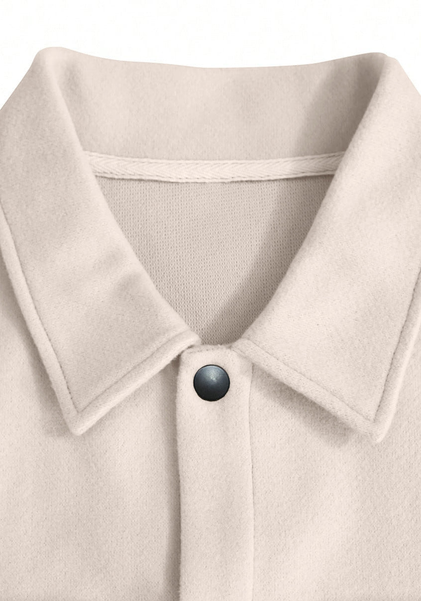 Off-white wool jacket lapel collar and button close-up