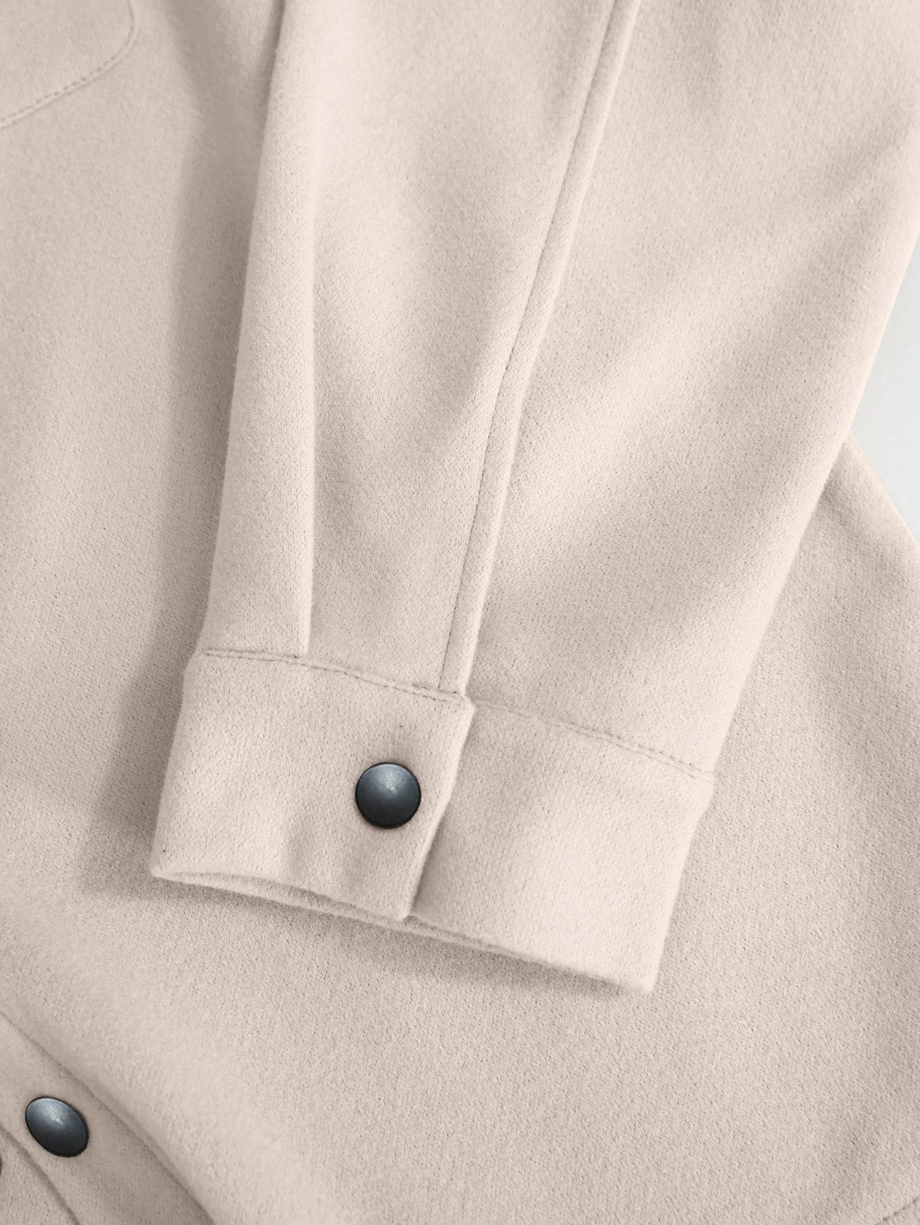 off-white wool jacket cuff and snap button close-up