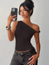 Model selfie styling sexy off shoulder top with black jeans for a summer look