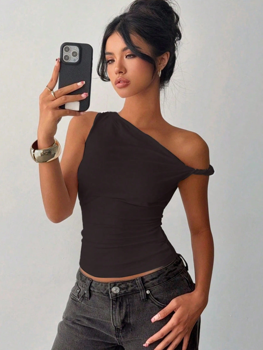 Model selfie styling sexy off shoulder top with black jeans for a summer look