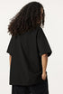 Back view of female model wearing black Ouroboros 8-ball tee