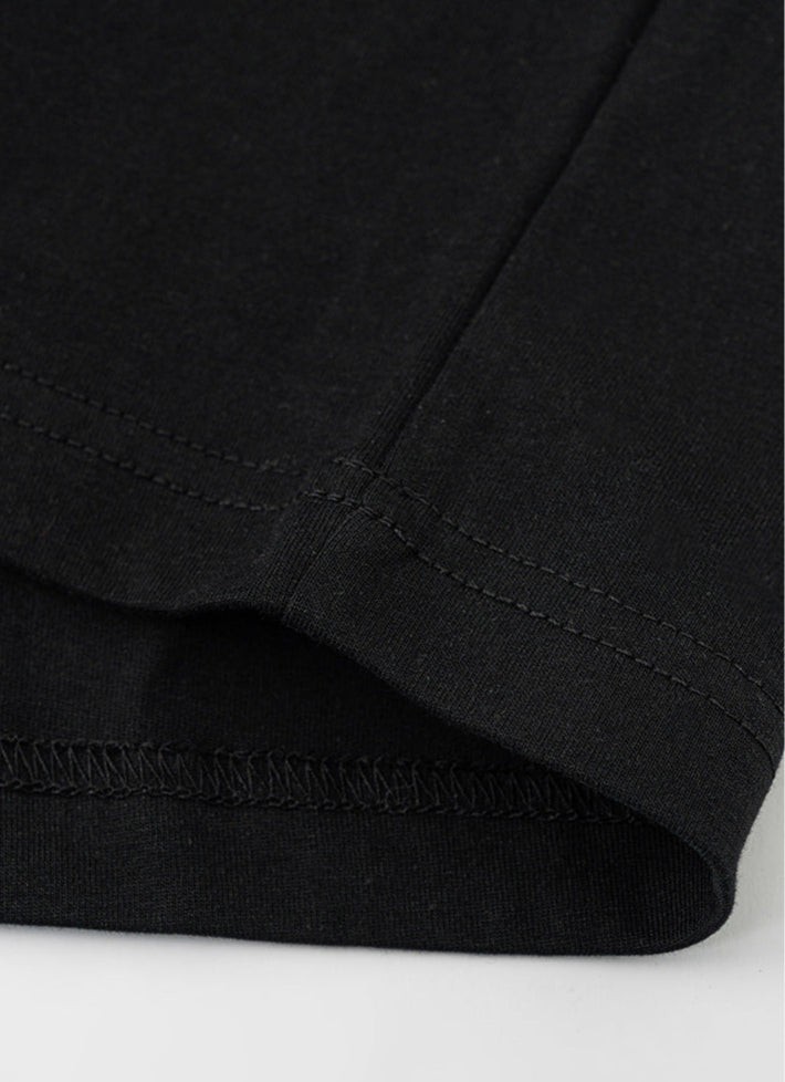 Close-up of black tee hem stitching