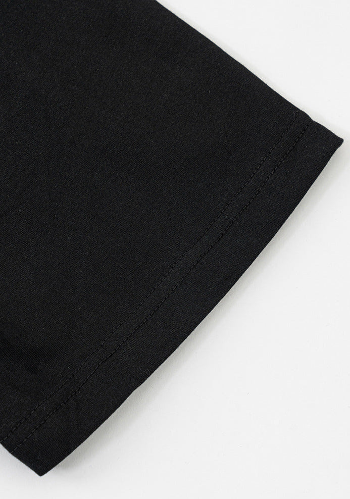 Close-up of black tee sleeve stitching