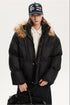 Front portrait view of a model in a black relaxed fit puffer coat with plush hood trim.