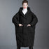 Front view of black hooded oversized puffer coat for women