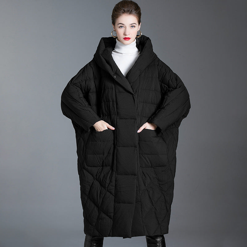 Front view of black hooded oversized puffer coat for women