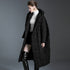 Side view of black oversized long down coat with hood