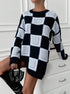 oversized black mock neck sweater with white geometric squares