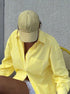 Oversized yellow striped button down shirt street style outfit