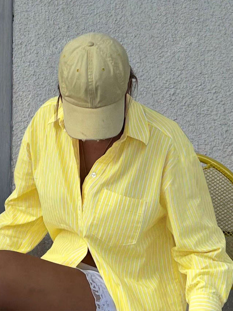Oversized yellow striped button down shirt street style outfit