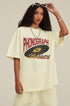 Model adjusts sunglasses while wearing oversized milk tea phonograph tee
