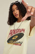 Close-up of model pointing at camera in vintage record tee