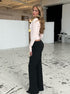 Light pink knit cardigan paired with matching pants side view