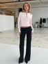 Light pink knit cardigan paired with matching pants