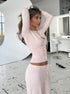 Soft pink knit cardigan sweater with button front detail side view