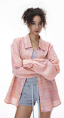 Pink plaid shirt open over mini dress, casual layer
