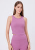 Pink sleeveless workout tank with ruched sides for yoga and gym