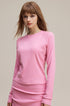 Front view of pink slim fit women’s long sleeve tee and skirt set