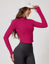 Pink zip up sports jacket with high neck and thumbholes