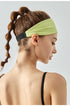 Back view of woman wearing pixie green headband with black elastic band.