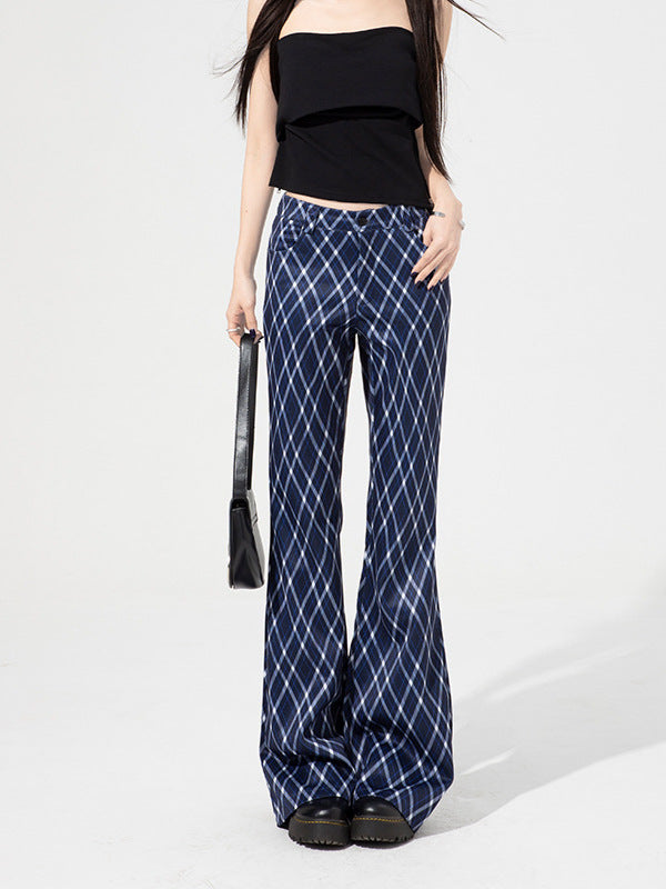 Woman wearing blue plaid high-waist flared pants with front pockets and black tube top.