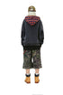 Back view of the washed black hoodie showing the red plaid contrast hood