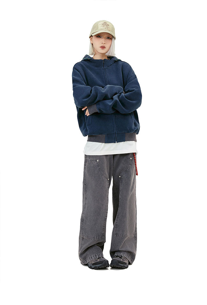 Washed navy plaid hood zip-up hoodie styled with wide gray jeans and a long white tee