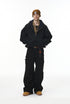 Black plush zip jacket, on-body front with wide pants.