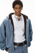 Blue plush zip jacket, fleece hood, on-body front view.
