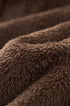 Brown fleece lining texture close-up for plush jacket.