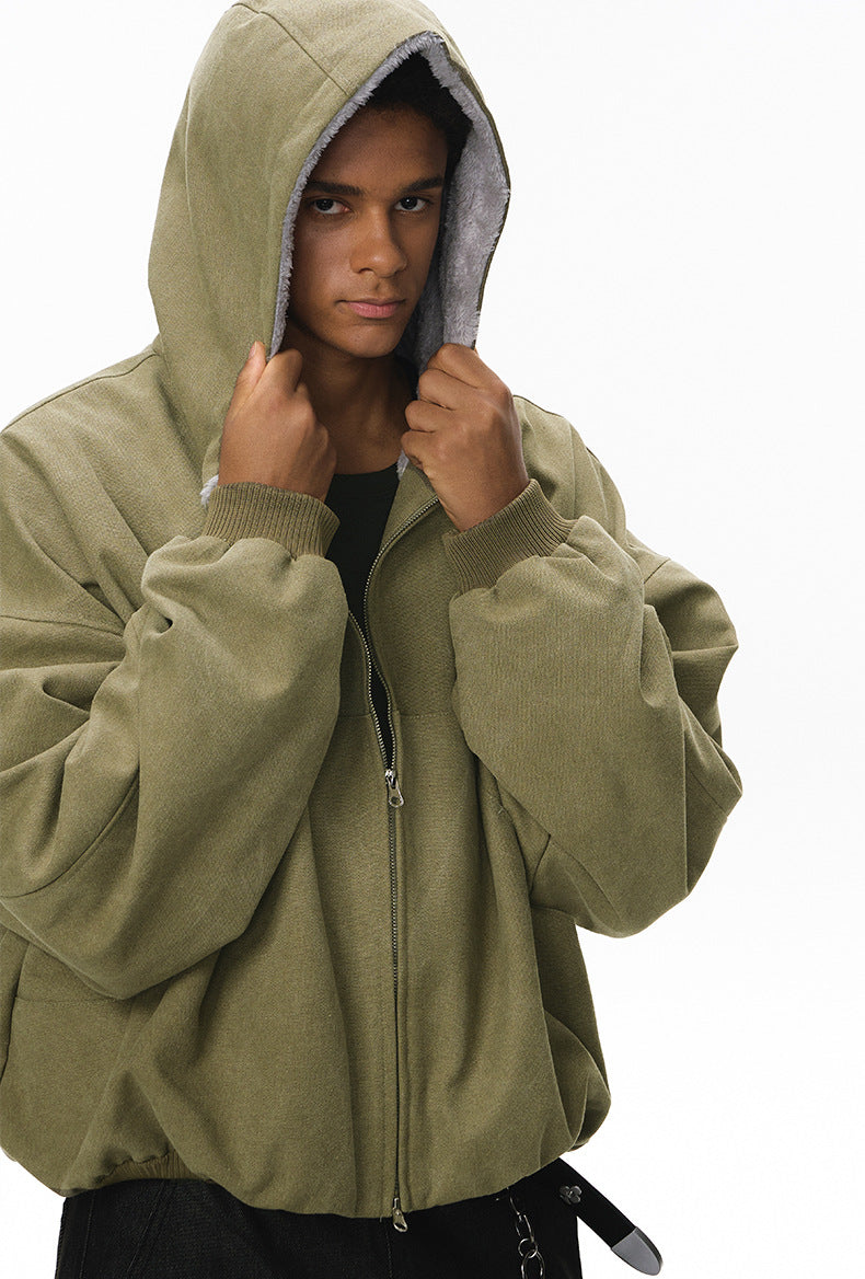 Green plush zip jacket, hood adjust, on-body portrait.