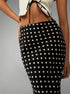 close-up high-waist detail, polka dot maxi skirt, smooth waistband and drape